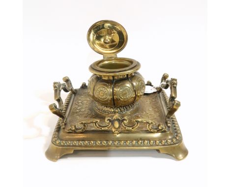 A brass ink well with pen rest Condition Report: Available upon request