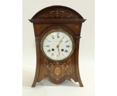 An Edward and Sons Edwardian mantle clock, the inlaid case with white enamel dial with Roman numerals, the movement marked Ma