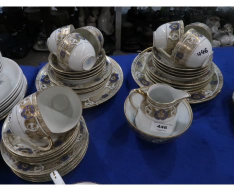 A Noritake gilt and blue decorated teaset Condition Report: saucers (12) - 1 chipped, losses to gilt. side plates (12) - 1 ch