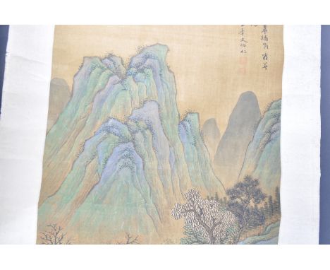 A 19th Century Chinese hand painted paper scroll. Depicts a landscape scene with series of figures &amp; buildings within tre
