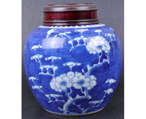 A 19th Century Chinese Kangxi mark blue and white porcelain ginger jar. Hand painted in the prunus pattern with blossoming wh