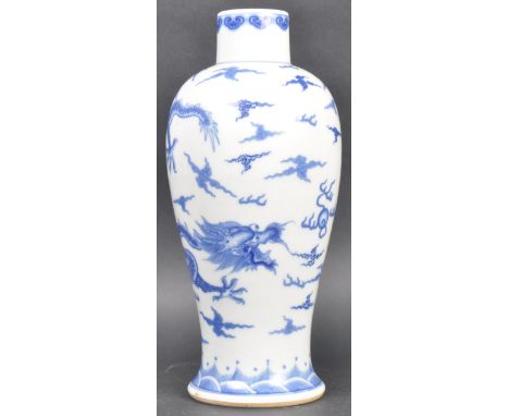 A 19th Century Chinese Kangxi mark blue and white porcelain vase of Meiping shape. Decoration depicting dragons with flaming 