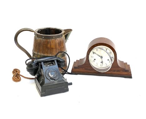 A vintage rotary dial telephone; a T. Wickenham mantel clock; and a large coopered wooden jug 