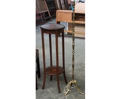 An Edwardian mahogany and strung circular pot stand, the top and undershelf with central patera, 34.5cmD 100cmH; together wit