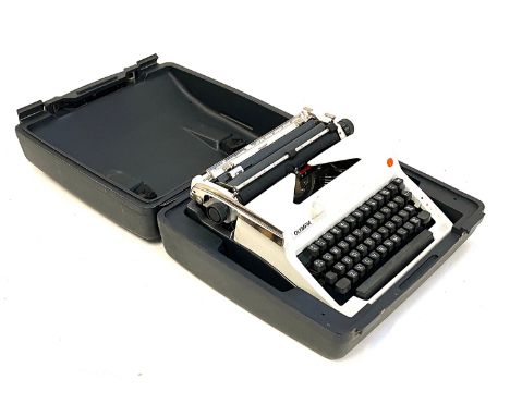 An Olympia typewriter in plastic carry case 