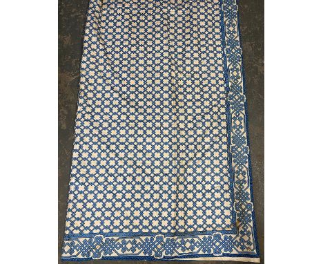 A long pair of lined chintz curtains, blue interlocking pattern, 240cm wide ungathered, 336cm drop 