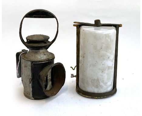 An antique railway lamp, the burner marked Sherwoods, 32cmH, together with a milk glass railway lamp, 26cmH 