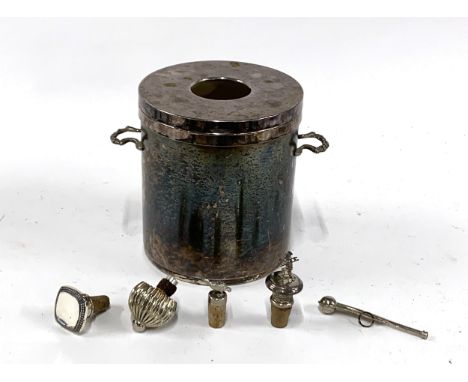 A silver plated wine bucket, 20cmH; together with four wine cork bottle stoppers, one with white metal pheasant, another with