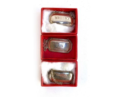 Three boxed silver decanter labels by Francis Howard Ltd, Sheffield 1986, Whisky, Sherry, and Gin 