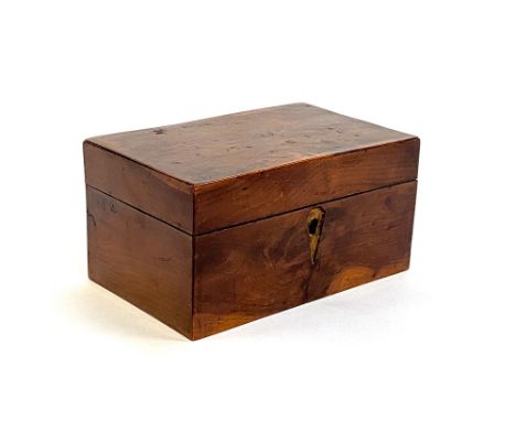 A yew wood tea caddy, lined in blue paper, 19cm wide 