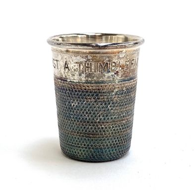 A novelty silver thimble spirit measure by P H Vogel &amp; Co, Birmingham 1962, , 'Just a Thumble Full', to measure 2 fluid o