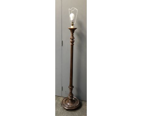 A carved wood standard lamp, 128cmH to base of fitting 