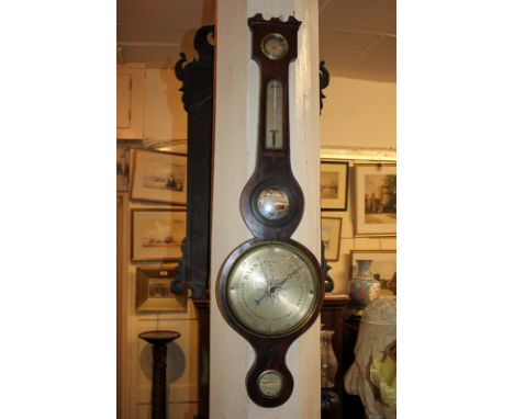A 19th century mahogany wall barometer with circular silvered dial, damp/dry dial, thermometer, mirror and level dial (a/f), 