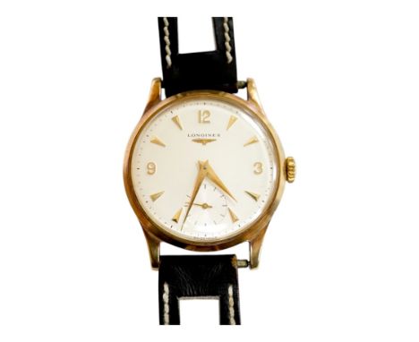 A gentleman's 9ct gold Longines manual wind wrist watch, with subsidiary seconds, case diameter 34mm, on a later associated l