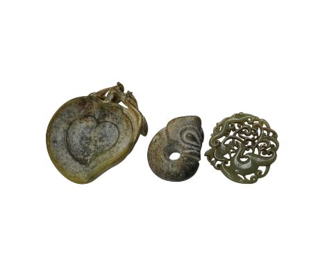 A 19th century Chinese reticulated celadon jade disc, 6.5cm diameter, a Ming style peach shaped brushwasher and a neolithic s