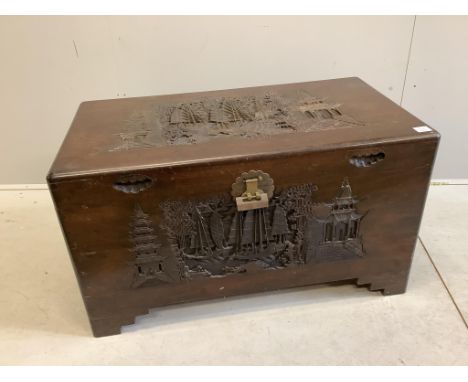 A Chinese carved camphorwood trunk, width 100cm, depth 55cm, height 57cm. Condition - fair