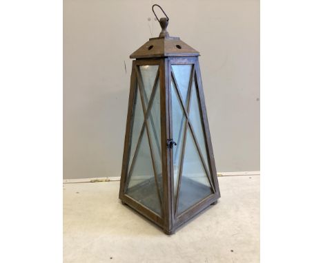 A large contemporary glazed pine interior candle lantern, height 86cm. Condition - good.