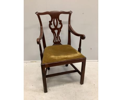 A George III Chippendale style mahogany elbow chair with a later similar elbow chair. Condition - fairProvenance: Constables 