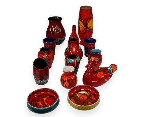 A group of Poole pottery to include vases, beakers and model duck, largest 23cm high (14).   Condition - mostly good