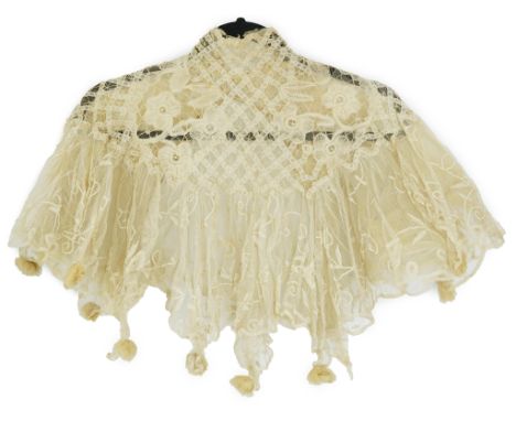 An Edwardian high collared cream tape lace wedding over blouse, made with a deep net frill and cream chiffon rose detail hang