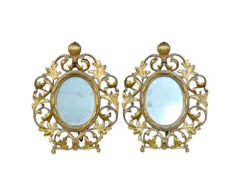 A pair of decorative oval ormolu easel framed mirrors, 28cm. Condition - good