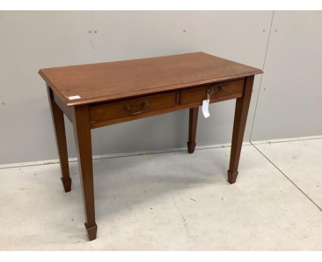 A George III style mahogany side table with two frieze drawers with swan neck brass handles and square tapered legs with spad