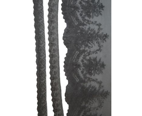 A black silk flounce of wide Chantilly lace trimming and two similar narrower Chantilly trimmings, the flounce with a deep fl