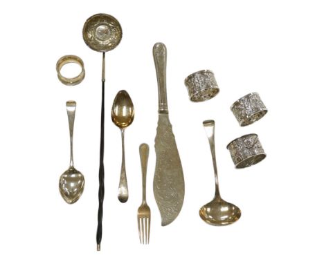 Small silver including a pair of napkin rings and two others, a Georgian sauce ladle and two similar dessert spoons, a fish s