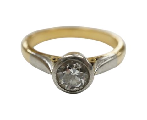 A yellow metal and collet set solitaire diamond set ring, size J/K, gross weight 4.2 grams. Condition - fair