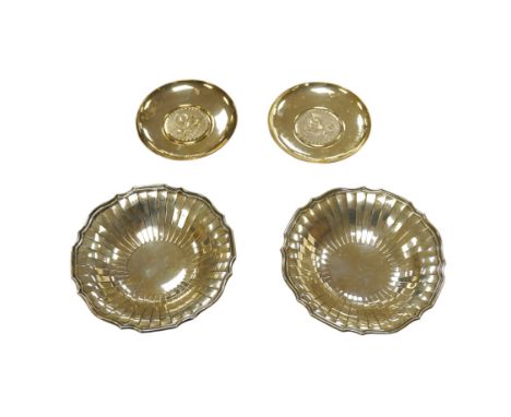 A pair of 1970's Brittania standard silver Prussian eagle inset commemorative trinket dishes, 96mm and an earlier pair of flu
