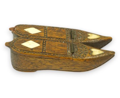 An early 19th century bone inset carved wood 'pair of shoes' snuff box with damaged sprung lid, 9.5cm long. Condition - good