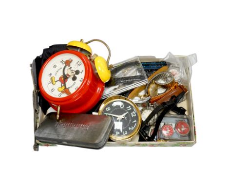 A group of assorted modern wrist watches including Sekonda, Camel and Timex Snoopy, together with two alarm clocks including 