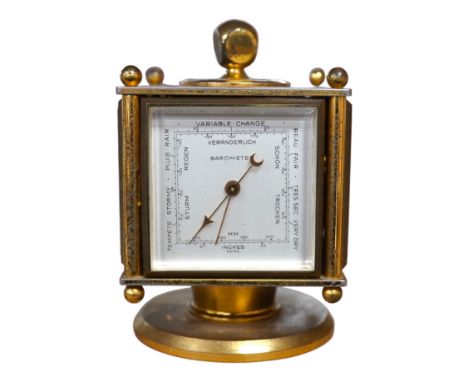 An Imhof brass combination clock, hydrometer, barometer and thermometer, 12cm high. Condition - fair
