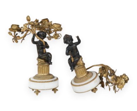 A pair of Louis XVI style bronze, ormolu and white marble figural candelabra, late 19th century, 28cm. Condition - as photogr