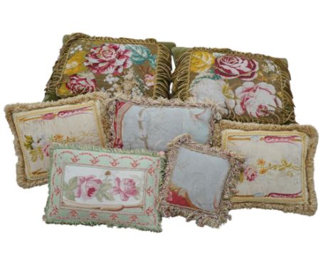 Seven 19th century cushions. Three Aubusson tapestry cushions and two machine Aubusson cushions, together with two floral woo