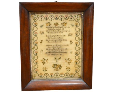 A wide mahogany framed sampler by Ann Whitehouse dated 1834, worked in coloured silks on a fine linen ground, in small stitch