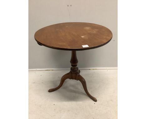A George III circular mahogany tilt top tripod tea table, diameter 69cm, height 72cm. Condition - fair