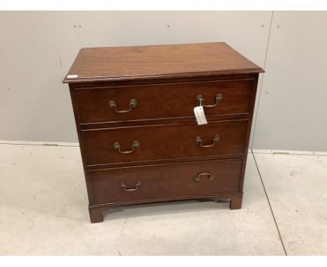 An early 20th century mahogany chest with a moulded top, three long drawers with brass loop handles and bracket feet, width 8