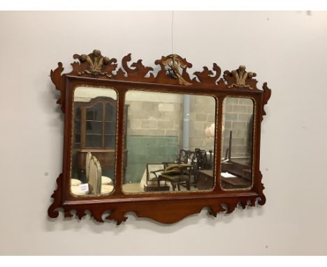 A George III style mahogany, parcel gilt triple plate fret cut wall mirror with Prince of Wales plume and phoenix pediment, w