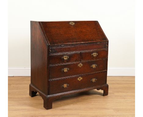 AN 18TH CENTURY OAK BUREAUWith stepped and welled interior 91cm wide; 50cm deep;; 101cm highOld marks and scratches and prese