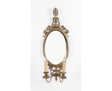 A NEO-CLASSICAL REVIVAL GILT-METAL TWIN LIGHT GIRANDOLELate 19th Century
Surmounted by a pierced anthemion urn and scrolls, f