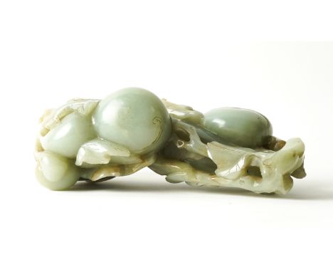 A  LARGE CHINESE JADE GROUP OF GOURDSCarved with one large and three smaller gourds attached to leafy branches, the stone of 