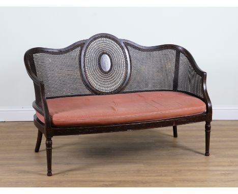 A VICTORIAN POLYCHROME PAINTED EBONISED CANE BACK SOFA144cm wide; 100cm high 

Provenance: Lady Rose Berger, nee Pepys (1927-