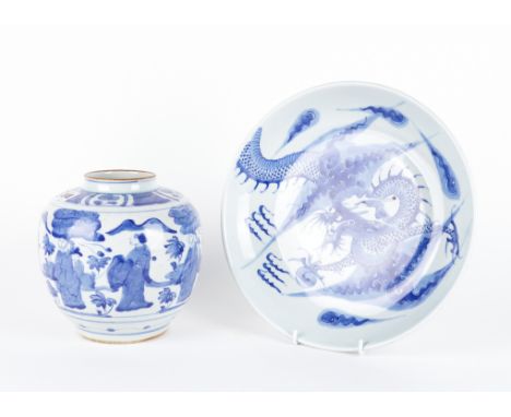 A CHINESE BLUE AND WHITE `DRAGON' DISHPainted with a dragon chasing a flaming pearl amongst cloud scrolls, 29cm diameter; and