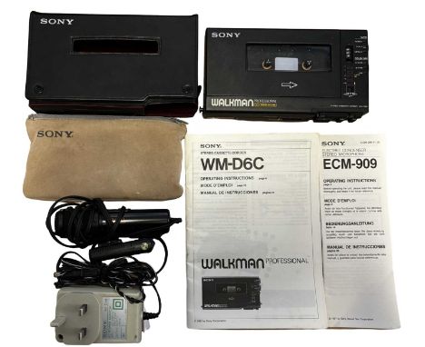 A Sony WM-D6C cassette-corder, with power supply, instruction manual and microphone in Sony branded bag