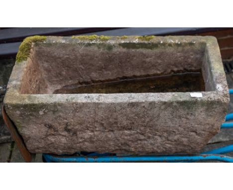 A rough hewn rectangular stone trough, 18th/ 19th century;: 28cm high, 73cm long, 38cm wide.