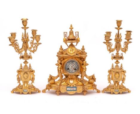 A French ormolu and Sevres clock garniture: the eight-day duration movement striking the hours and half-hours on a bell with 