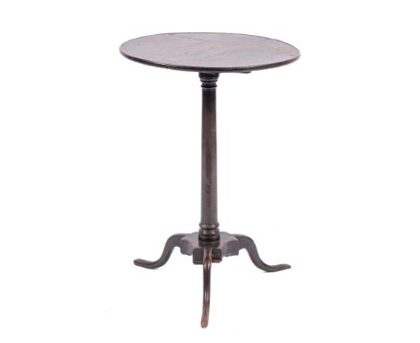 A George II oak tripod table, mid 18th century,: the dished circular top on a slender knopped and waisted shaft, to a triform