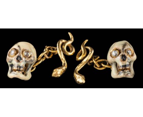 A pair of enamel and diamond skull cufflinks,: the enamel skulls with rose cut diamond set eyes, with belcher link connectors