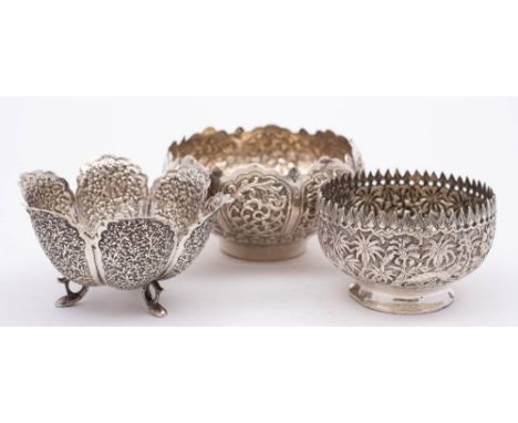 An Indian silver sugar basin: of circular form with embossed  jungle scenes, 8cm diameter, together with two other Indo-Persi